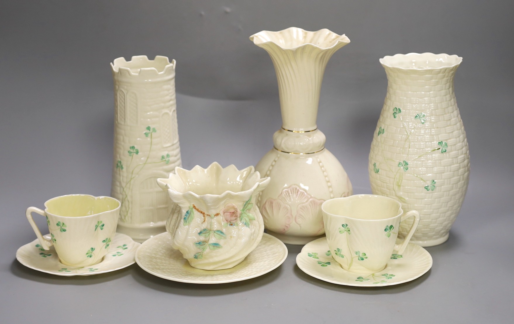 A small collection of Belleek porcelain (9, including saucers)